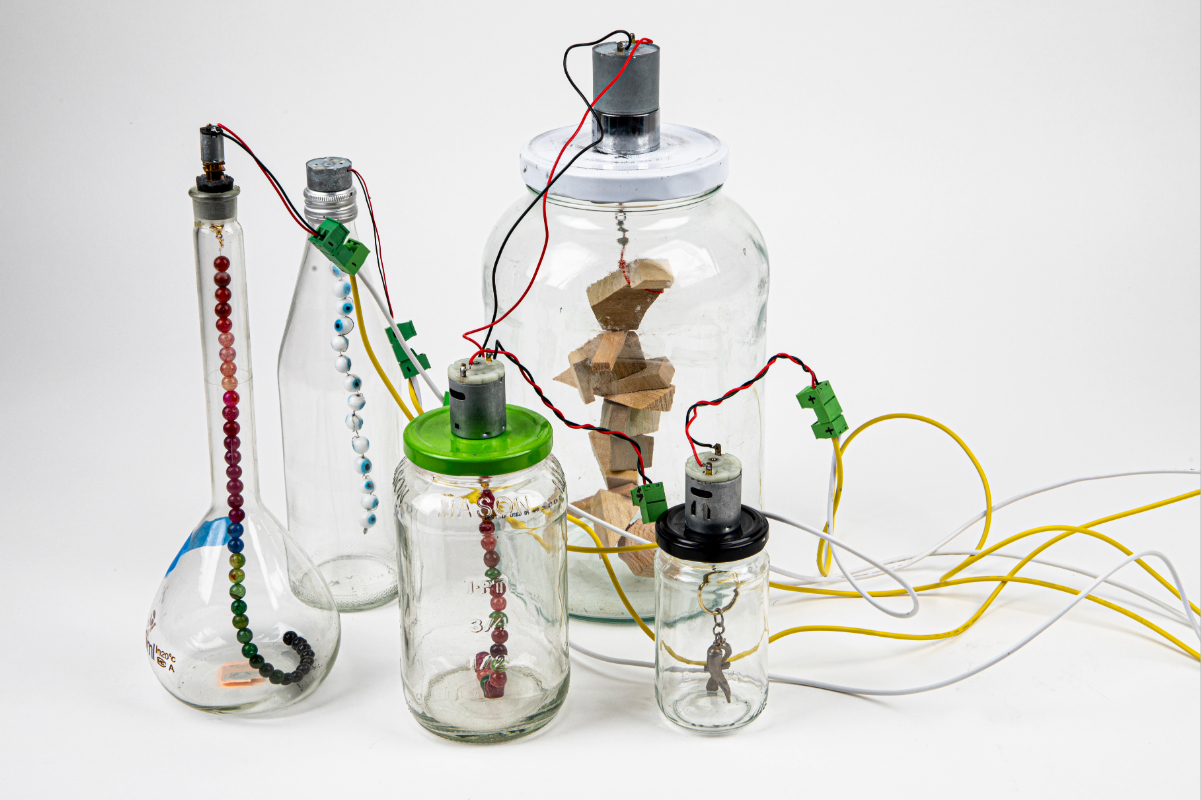 image of colorful jars on white background