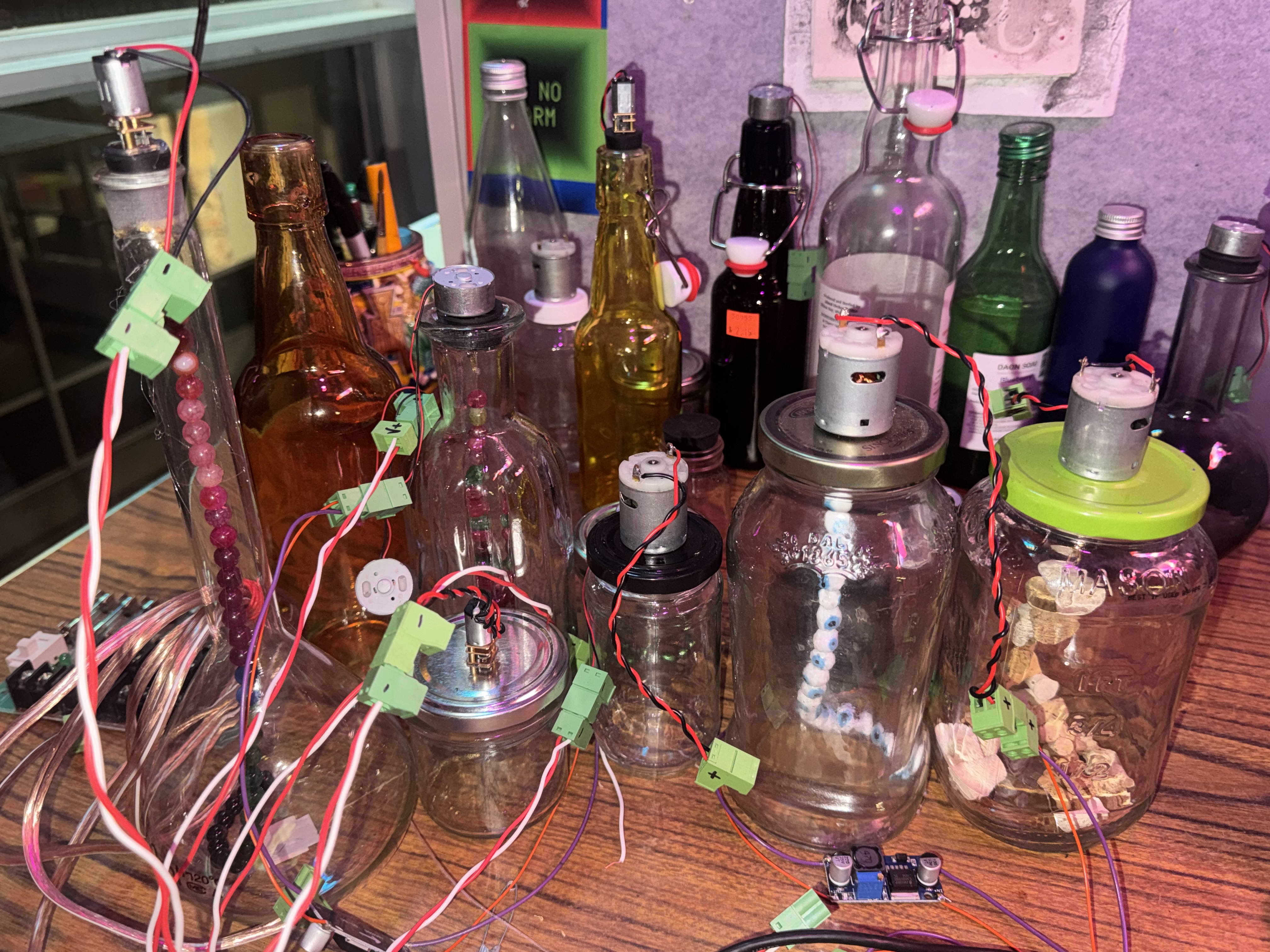 image of colorful jars on desk with wires sticking out